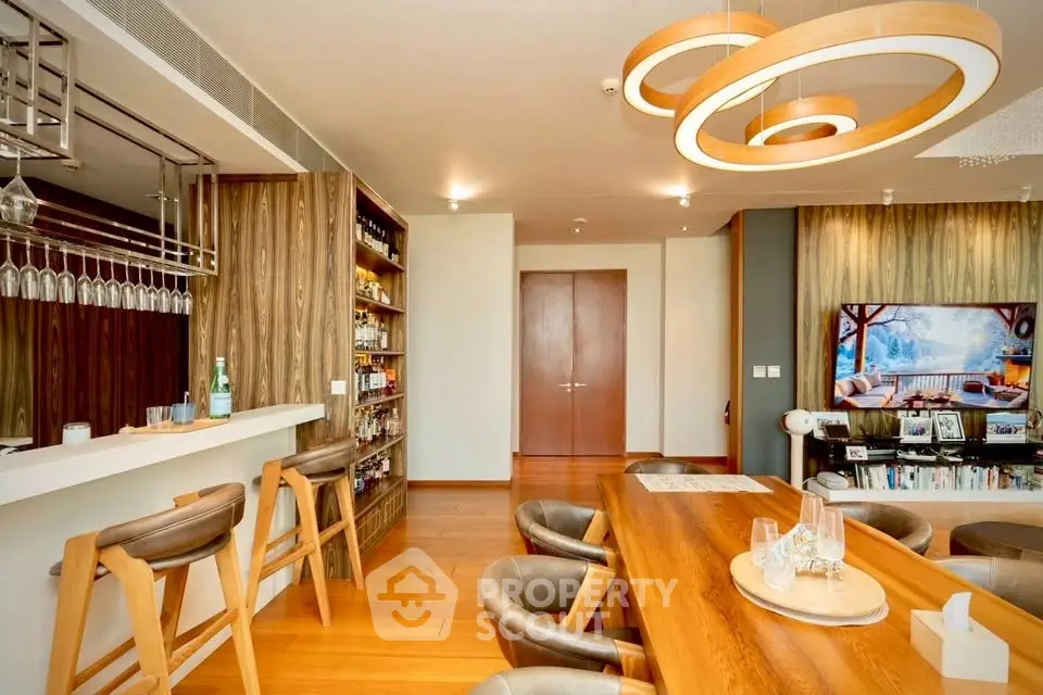 Luxurious modern living room with stylish wooden decor and elegant lighting, perfect for entertaining guests.