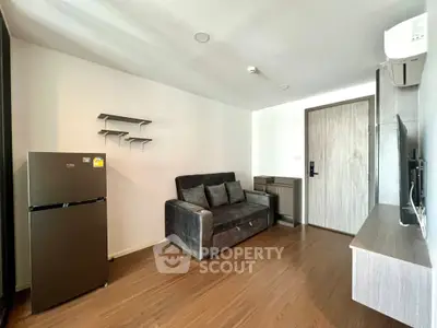Modern living room with sleek furniture and wooden flooring