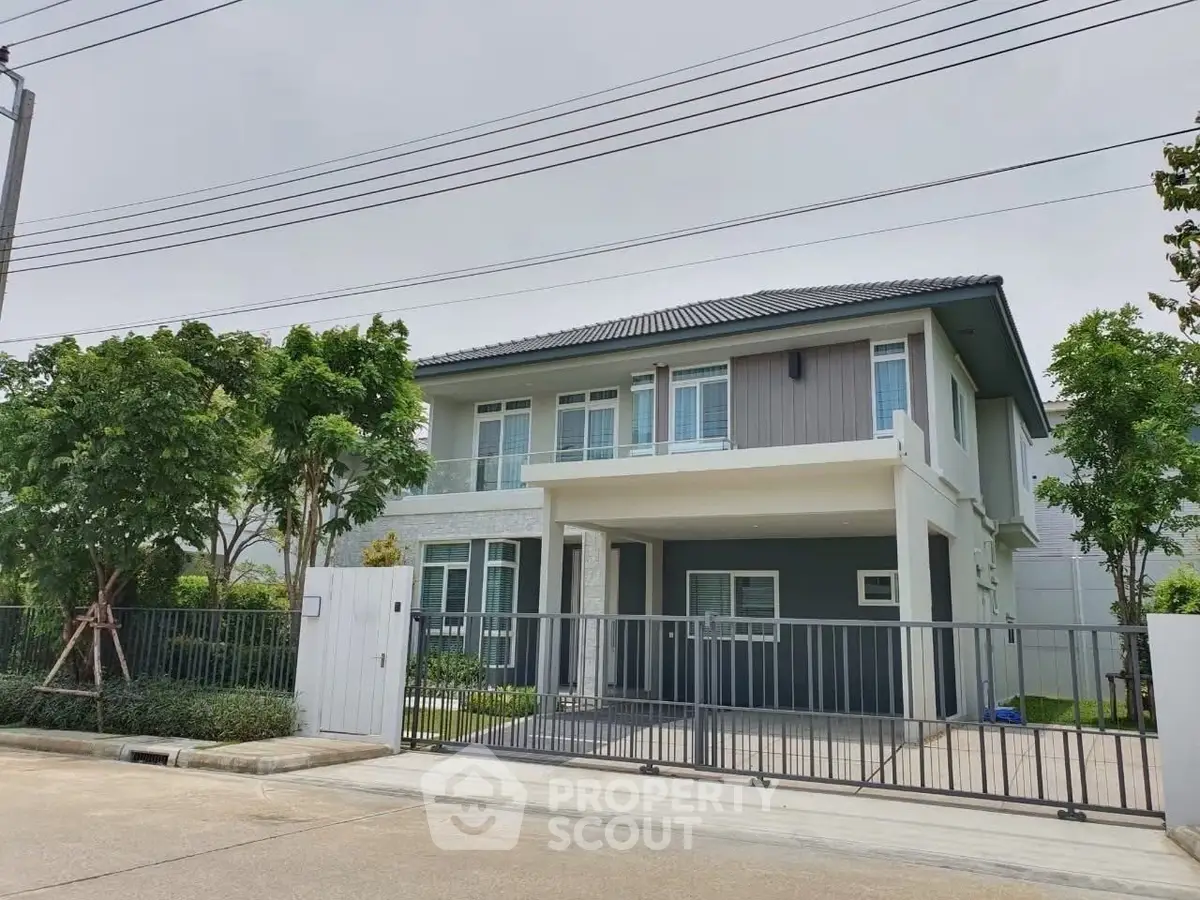 Modern two-story house with sleek design and spacious driveway