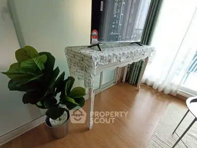 Bright living room with elegant console table and lush green plant