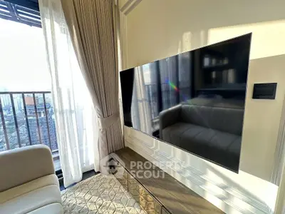 Luxurious living room with modern TV and stunning city view from balcony