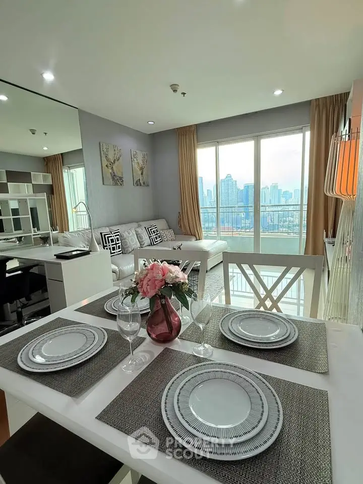 Stylish living room with dining area and stunning city view, perfect for modern urban living.