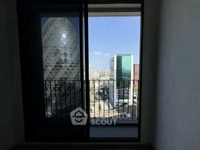 Stunning cityscape view from a modern apartment balcony with iconic architecture.