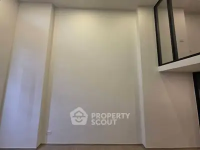 Spacious modern interior with high ceilings and mezzanine level