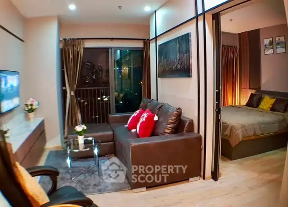 Modern apartment living room with cozy sofa and city view, adjacent to stylish bedroom.