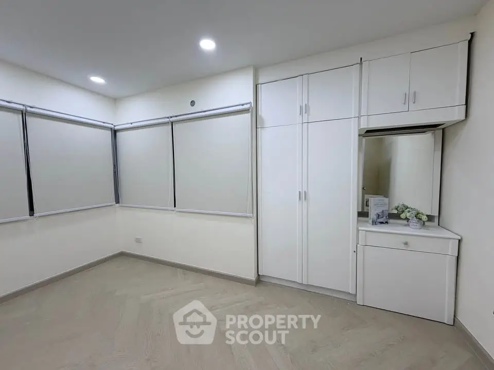Spacious corner unit with built-in storage and modern lighting