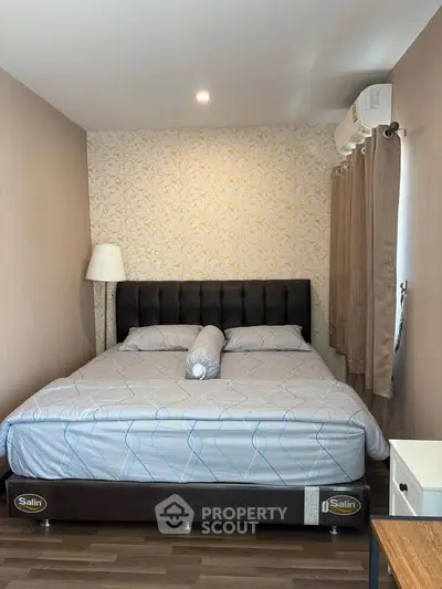 Cozy bedroom with stylish wallpaper and modern furnishings