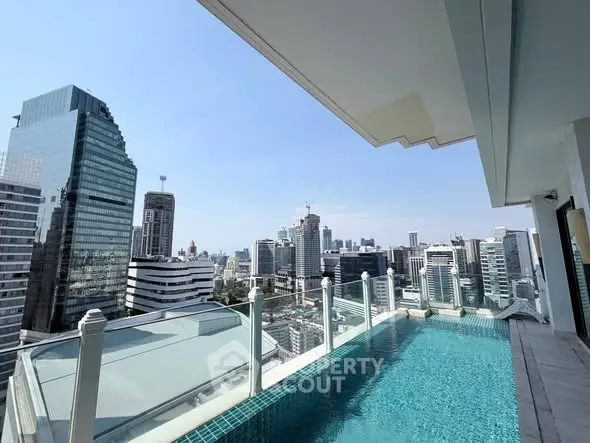 Stunning rooftop pool with breathtaking city skyline view