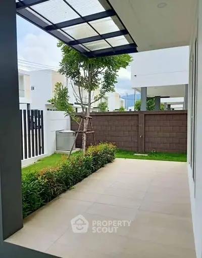 Modern patio with tiled flooring and garden view in contemporary home