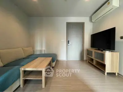 Modern living room with sleek furniture and air conditioning