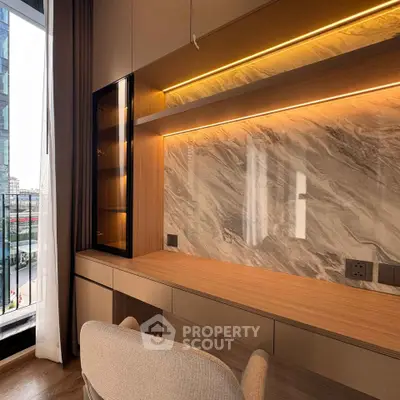 Luxurious study area with elegant marble backsplash and modern lighting, overlooking a stunning city view.