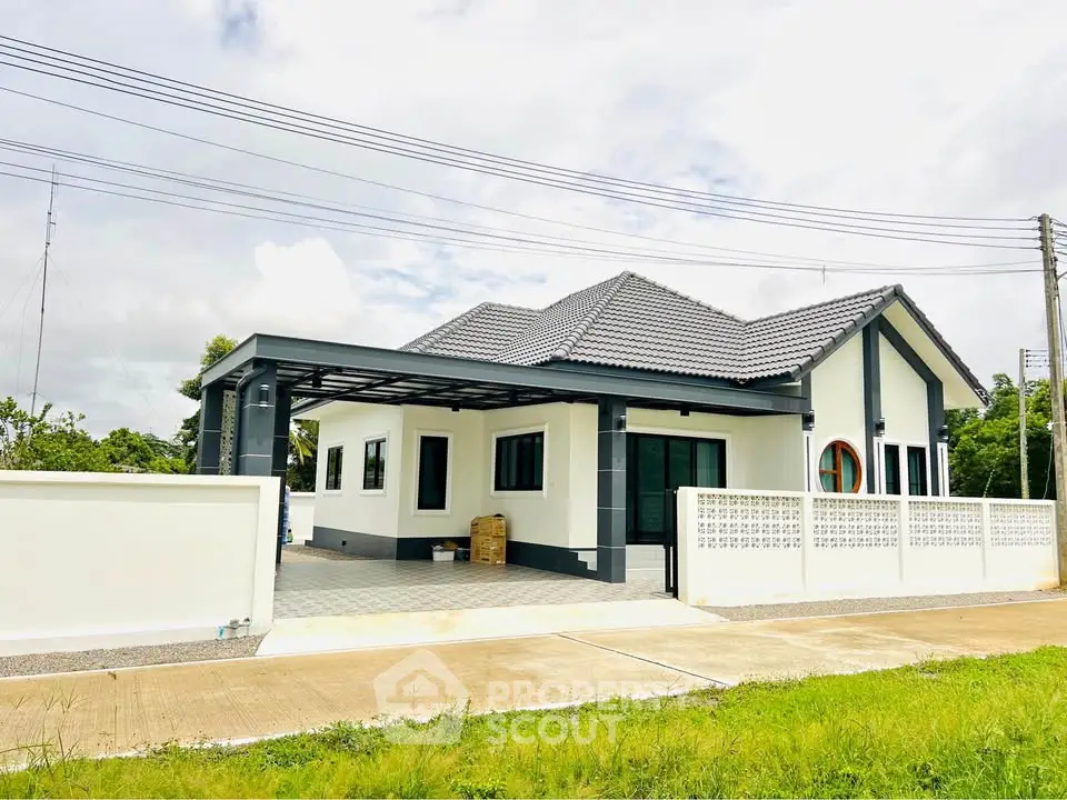 Charming modern house with sleek design and spacious driveway in a serene neighborhood.