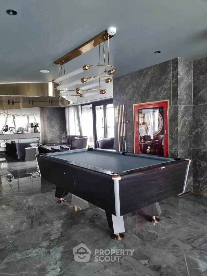Luxurious living room with pool table and modern decor