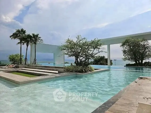 Luxurious beachfront pool with stunning ocean view and modern design