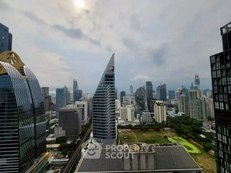 Stunning cityscape view showcasing modern skyscrapers and lush greenery, perfect for urban living.