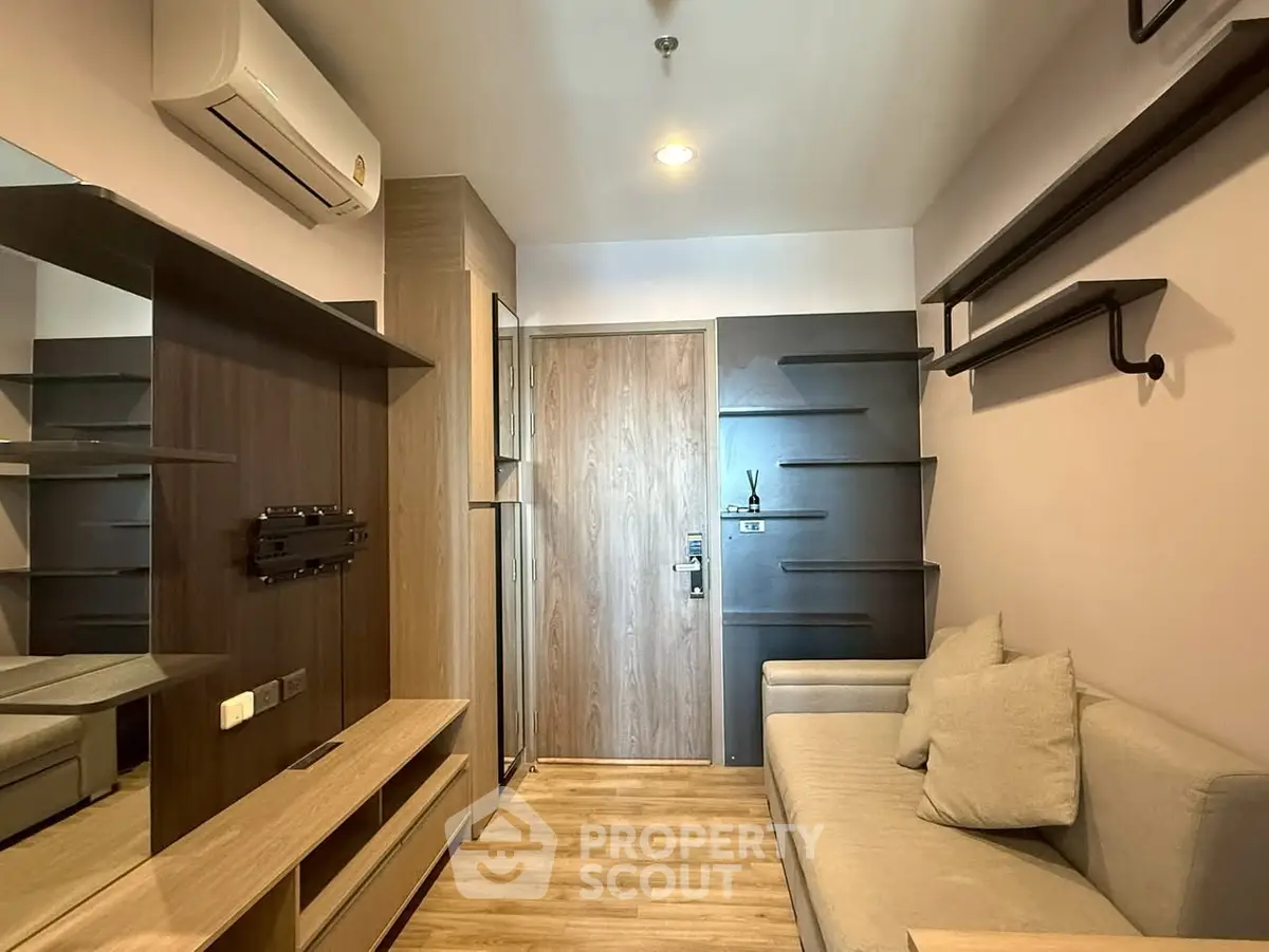 Modern living room with sleek design and cozy sofa in stylish apartment.