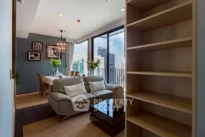 Modern living room with elegant dining area and city view balcony