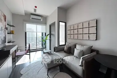 Modern living room with stylish decor and city view balcony