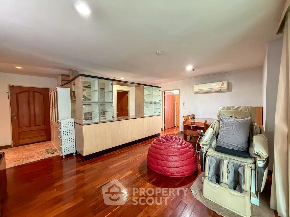 Spacious living room with wooden flooring and modern furniture