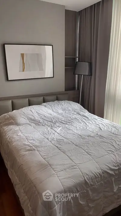 Modern bedroom with stylish decor and natural light
