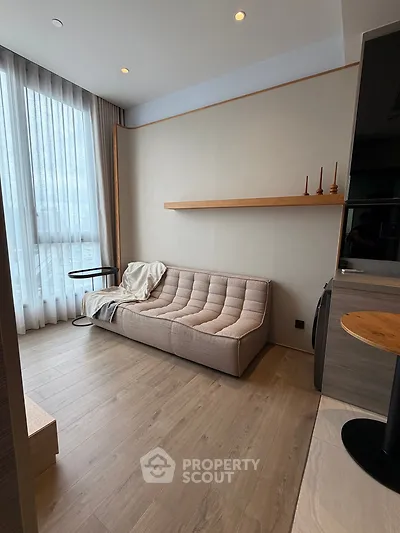 Modern living room with stylish sofa and floor-to-ceiling window