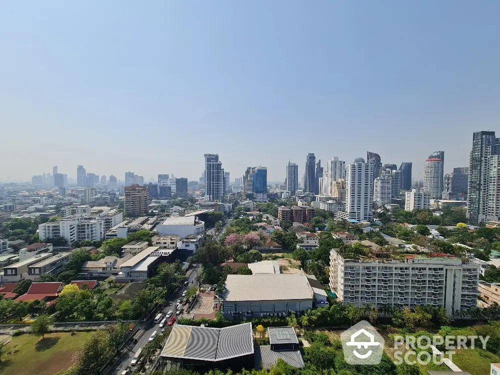 Stunning cityscape view showcasing urban skyline and lush greenery, perfect for real estate investment.