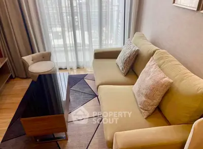 Cozy living room with modern sofa and stylish decor, perfect for relaxation and entertaining.