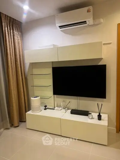 Modern living room with sleek TV unit and air conditioning