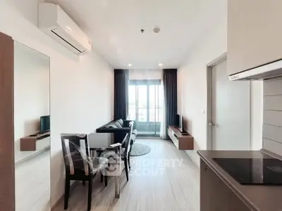 Modern living room with sleek furniture and natural light in a stylish apartment.