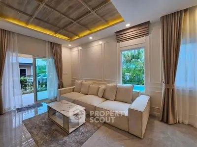Luxurious living room with elegant decor, large windows, and modern furniture in a stylish home.