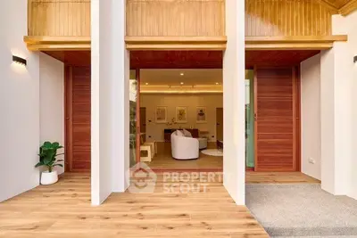Modern open-plan living room with wooden accents and stylish decor