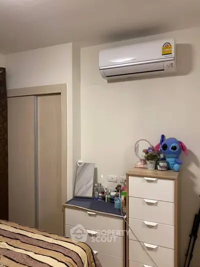 Cozy bedroom with air conditioning and ample storage space