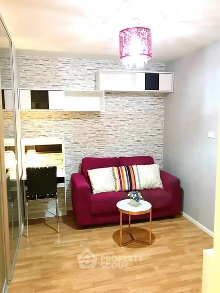 Cozy living room with modern decor and vibrant red sofa