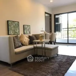 Modern living room with cozy sofa and balcony view