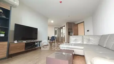 Spacious modern living room with sleek furniture and open layout