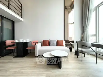 Modern living room with high ceilings and stylish furniture in a bright apartment