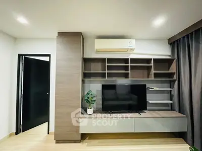 Modern living room with sleek TV unit and air conditioning