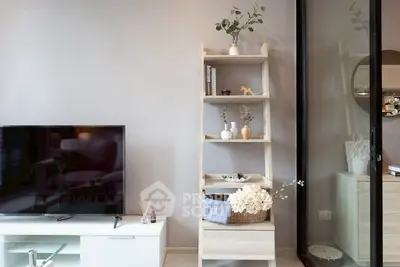 Modern living room with sleek TV unit and stylish shelving