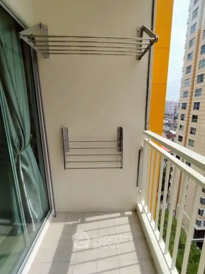 Modern balcony with drying racks and city view, perfect for urban living.