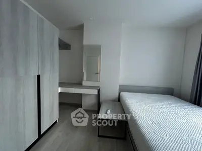Modern minimalist bedroom with sleek furniture and natural light