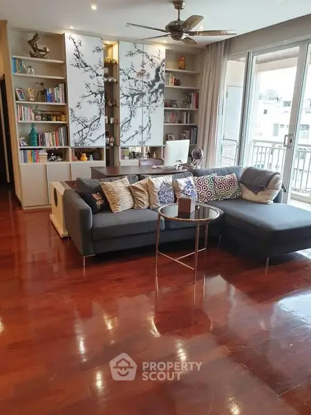 Spacious living room with elegant wooden flooring and modern decor
