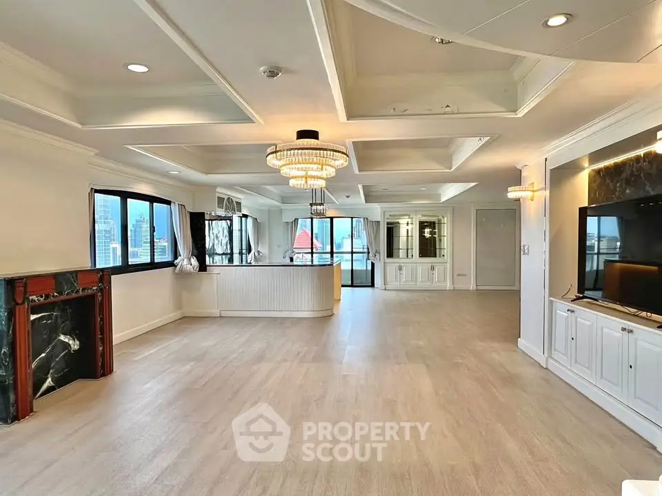 Spacious luxury living room with elegant chandelier and city view