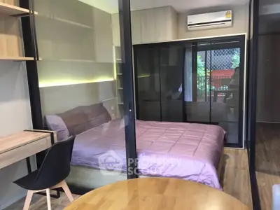 Modern bedroom with glass partition and stylish decor