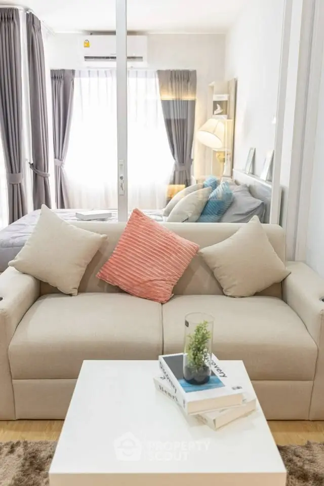Modern living room with cozy beige sofa and stylish decor
