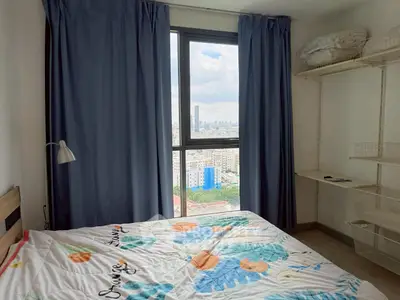 Cozy bedroom with city view and ample natural light