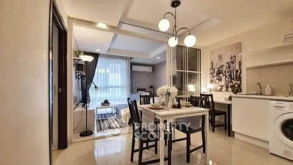 Modern open-plan living and dining area with stylish decor and natural light.