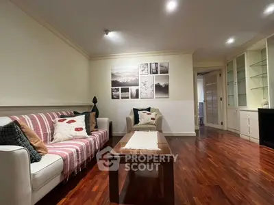 Cozy living room with elegant wooden flooring and stylish decor