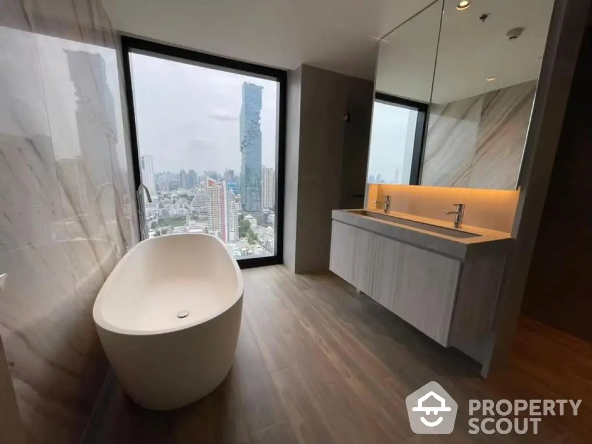 Luxurious bathroom with freestanding bathtub and stunning city view