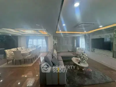 Luxurious living room with elegant dining area and modern decor