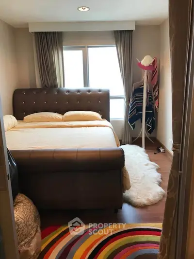 Cozy bedroom with stylish decor and natural light